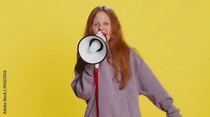 Young preteen child girl kid talking with megaphone, proclaiming news, loudly announcing advertisement discounts sale using loudspeaker to shout speech. Teenager children isolated on yellow background