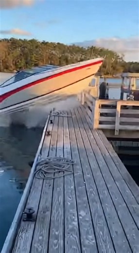 Speeding Boat Launches Over Dock And Nearly Strikes Bystanders Lake Norman, North Carolina — A chaotic scene unfolded at a busy marina when a boat approached a dock at high speed and failed to slow down in time. Video shows the vessel riding up one section of the dock like a ramp, lifting into the air and clearing a group of people standing nearby before slamming down onto another section of the pier. Onlookers scatter as the boat crashes down, narrowly avoiding serious injuries. The reckless ma