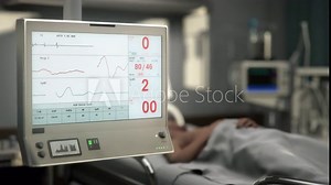 Monitoring Vital Pulse Signs Of Patient By ECG Computer Device. Pulse Monitoring Computer Records Failure In Patients Heart. Pulse Monitoring Computer Shows Death Of Patient From Heart Illness