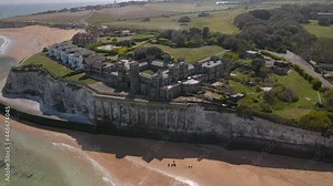 Kingsgate castle Kent chalk cliff British coastal bay landmark Aerial view wide orbit left