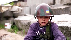 Twelve-year-old Andrii and six-year-old Valentyn build checkpoints and dug trenches in the village of Stoianka, near Kyiv. The two boys want to be soldiers when they grow up and hope to defend their country one day. | Reuters