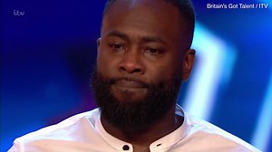 Simon Cowell presses the Golden Buzzer for comedian act Kojo Anim
