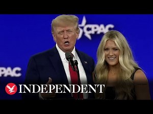 Watch moment Trump welcomes anti-trans swimmer onstage at CPAC