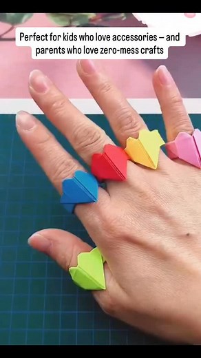 7.8K views · 2.6K reactions | Origami rings are a fast, fun craft that kids love! Just fold a small strip of paper, shape it into a loop, and decorate however you like. They’re great for pretend play, parties, or making cute handmade gifts. Simple, colorful, and perfect for boosting fine motor skills. origami ring, paper jewelry, easy craft, kids activity | GenioKid - Early Learning: speech, counting, motor skills | Facebook