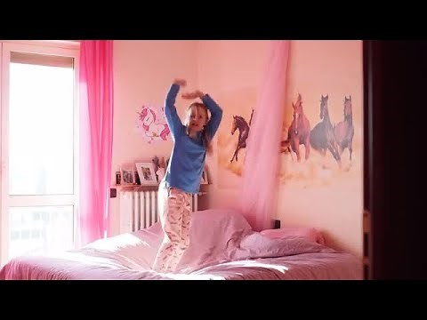 Girl Jumps On The Bed Stock Video