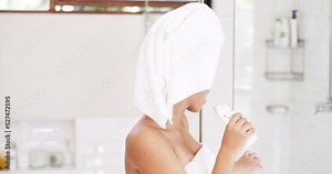 Woman dancing and singing after shower in the bathroom, doing happy dance after body care and cleaning skincare in house. Portrait of funny and crazy dancer and singer with smile in the morning