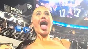 Model Danii Banks flashes in stands during NFL game and is kicked out stadium
