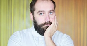 Man is bored during a conversation, class. 4k. portrait. Slow motion