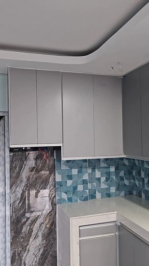 Aluminum modular cabinet Pc white frame Silver gray cladding Continuous handle silver Stainless pull out basket Drawer with cutlery Rangehood Concealed hinges soft close Trash bin #follower #viralvideochallenge #friends #anotherdayanotherblessing #anotherdayanotherworkz #Cavite #SilangCavite #tagaytaystaycation | Pampan Arellano Workz