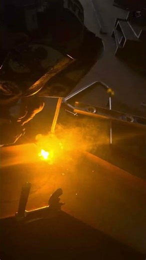 Stick welding to tack together two beams at slope