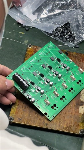 “Skilled Workers Ensuring Accuracy with Jig-Assisted Soldering ⚙️”