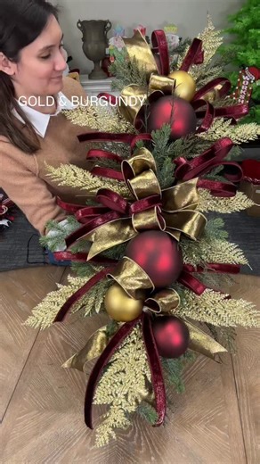 Emily Waldo on Instagram: "✨ Let’s talk about the most POPULAR ornament color from our store this season: “CRIMSON” 🙌 Today we are making a magical Tablescape (or garland… or door swag depending how you display it!) with our crimson red baubles! ✨ These are @vickermancompany ornaments, so the wire is drilled through the ball for super easy display! 💪 Everything for this design can be found in the shop (in limited quantities, though! We are selling out quick!) Let me know your thoughts on this 