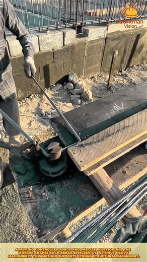 Skilled Worker Bending Reinforcement Steel with Manual Rebar Tool on Construction Site