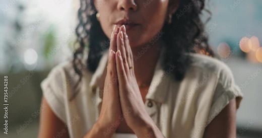 Hands, praying and woman with faith at her home for worship, religion or spiritual wellness. Gratitude, prayer and closeup of female person with christian praise for healing and peace in apartment.