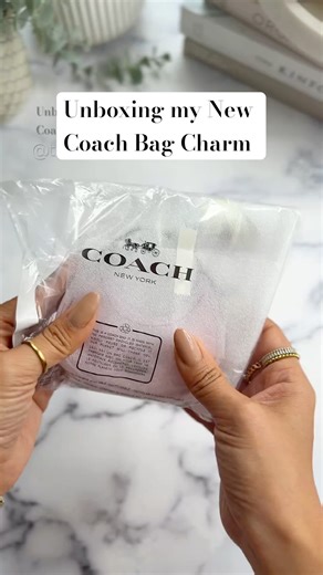 How cute is this 🥹 #unboxingvideo #bagcharm #minibag #asmrunboxing #coachbag #tinythings #unboxing
