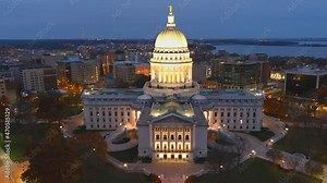 Beautiful Madison Wisconsin State Capitol Building at night, this is the people's house. Its architecture and grandeur make it easy to mistake for the US Capital, dynamic moving aerial view.