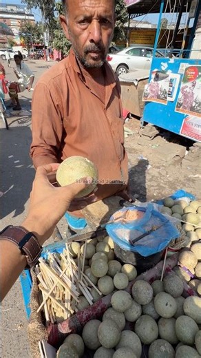 Friendly Uncle Sells Wood Apple Fruit in Bangladesh