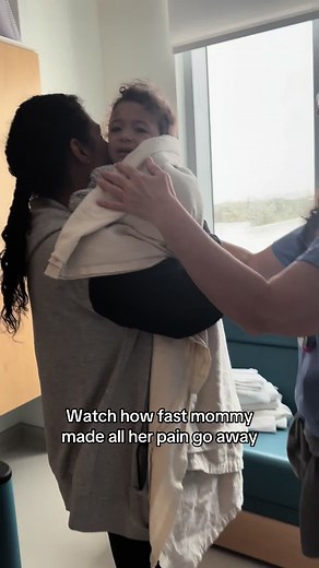 Mom Calms Baby in Crib After Painful Wake-Up