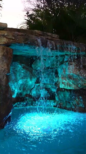 Natural Rock Grotto! We design and build backyards that make every day feel like a vacation. #pool