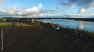 Typical Sweden countryside landscape with church on lake shore