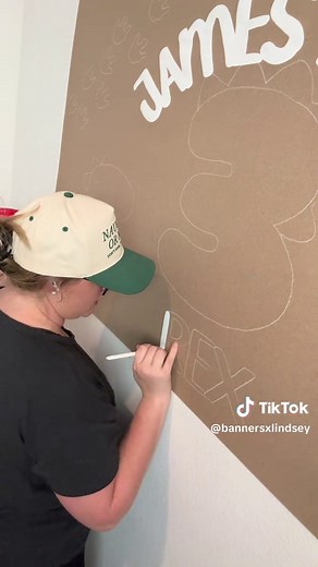 Create a Hand-Painted Dinosaur Banner for Events