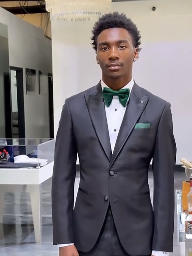 Dapper Prom Style: Sleek Black Suit with Green Accents