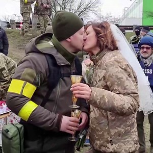 461K views · 7K reactions | Two members of Ukraine's territorial defense unit donned their military uniforms instead of traditional garb as they got married Sunday at a checkpoint outside of Kyiv. | CBS News | Facebook