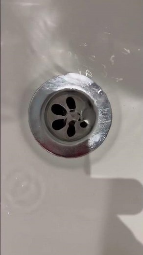 Mesmerizing Water Spiral: Watch the Sink Drain in Slow Motion