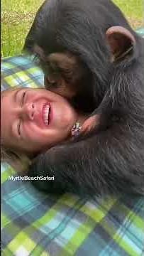 Monkey kissing her!