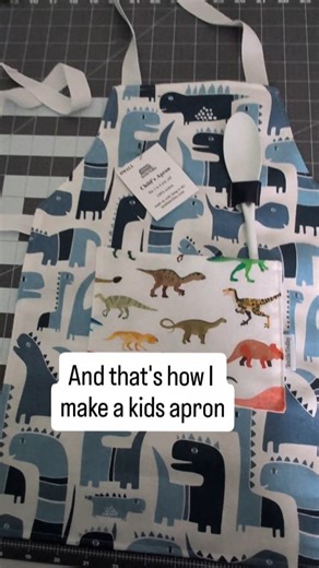 DOES YOUR KID LIKE TO COOK? Here's a quick version of how i make my kids aprons. Mark it Cut it Serge edges Add spoon loop and pocket Hem around edge adding straps Add tag and spoon It's not difficult but you need to be precise and it's time consuming. These aprons come in 2 sides and 5 different fabrics, dinosaur, cars and trucks, rainbow, mermaid and unicorn. They can be used for cooking and baking or as an art smock and they're made of 100% cotton canvas. #sewing #handmade #kidscooking #bakin