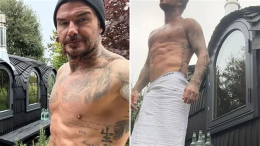David Beckham shows off his chiselled six pack as he poses in a towel