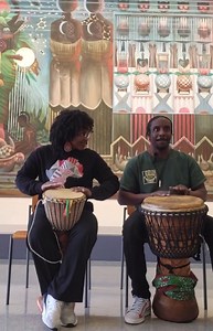 🎶🇨🇻 From Praia’s Heartbeat to Houston’s Rhythm: Meet Tida Batukadera, the Soul of Batuka 🥁✨ Embark on a rhythmic journey with the extraordinary Tida Batukadera, a beacon of Cape Verdean culture and a maestro of movement. Her hands speak the language of our ancestors, teaching the pulsating dance of Batuka to hearts eager to learn. In this captivating video, watch Tida, a proud Praia native and New Bedford High alumna, as she brings the essence of Cape Verde to Houston, Texas. She sits, a pic