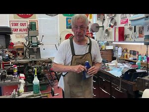 1574. Hooking the spring arbor to the center of the main spring. ￼