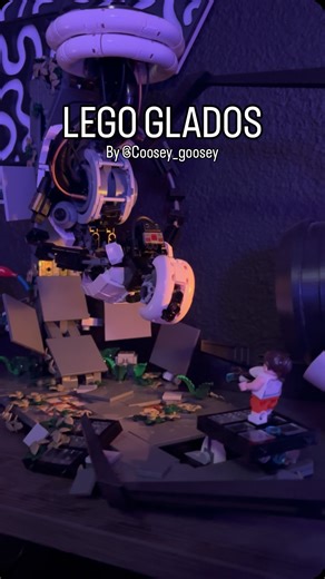Mick on Instagram: "Got this custom Lego set for my fiancé. So cool and so much fun to build. Love the potato easter egg, I still need to get a lego crow for it lol 😂 Lighting from our portal gun was a surprise bonus, so so so cool Set designed by @coosey_goosey This was so much fun to film even though he was super sick of me sticking my phone in front of him 😭 #portal2 #customlegobuild #glados #portal #legos"