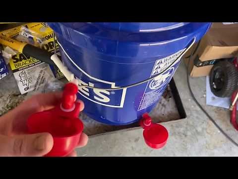 Poultry watering cups installed on a 5 gallon bucket RentACoop 4 pack automatic chicken kit