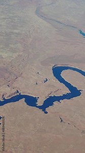 Close up panning shot off lake powell utah usa river stream remote desert area location airplane window seat view