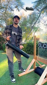 Testing the strength of a police riot shield