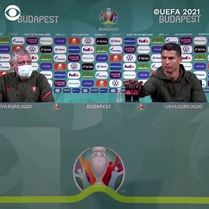 "Water!": Portuguese soccer superstar Cristiano Ronaldo removed two bottles of Coca-Cola, which sponsors the Euro tournament, away from him as he entered a news conference on Monday before holding up a bottle of water to the media. | CBS News