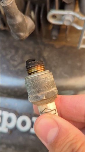 Remove and clean the Masport Lawn Mower Spark Plug