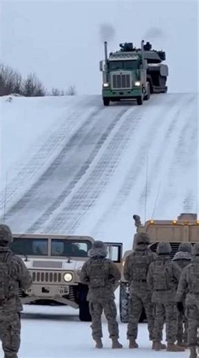 Tank falls off trailer truck crashes into humvee