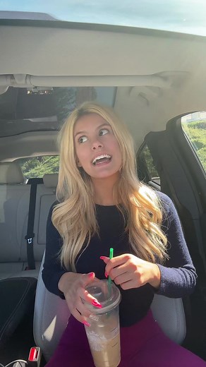 Starbucks Sip Inside a Car with Greenery View