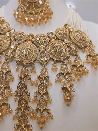 Semi Bridal Waterfall Necklace Set. Available in multi and Gold #gold #earrings #jewelry #necklace #latest