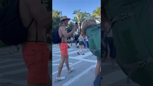 Backpack dog spreading good vibes on the beach! #ebike #dogbackpack #goldendoodle #miami