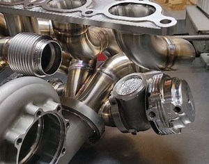 16K views · 10K reactions | Down to the final weld. A lot going on here, with this wastegate routed behind the turbo for better packaging, and another recirculated wastegate on the other side. Will likely make a quick video showing all of the things on the engine that needed to be plumbed around to make it happen | Morrison Fabrications | Facebook