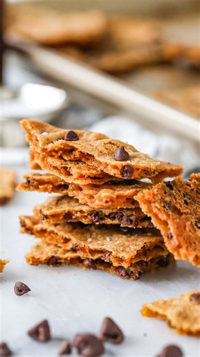 A sweet, snappy cross between brittle candy and classic chocolate chip cookies, this chocolate chip cookie brittle is unlike any cookie (or candy!) you’ve had before. It’s a perfectly irresistible, unique treat! Want the recipe? Comment “recipe” below or find it here: https://sugarspunrun.com/chewy-chocolate-chip-cookie-brittle/ #cookiebrittle #cookies #cookie | Sugar Spun Run