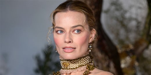 Margot Robbie's 30-Year-Old Plunging Leather Corset Comes With Matching Puffy Miniskirt and Heel-Less Stilettos