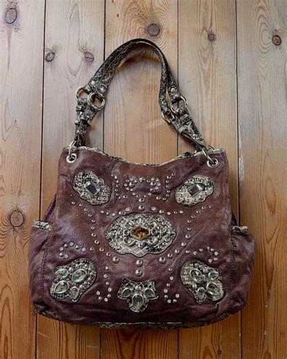 @magdyycorner | kathy van zeeland jeweled bag features a chocolate brown pebbled base with shimmering python trim. it’s adorned with shiny silver studs and... | Instagram