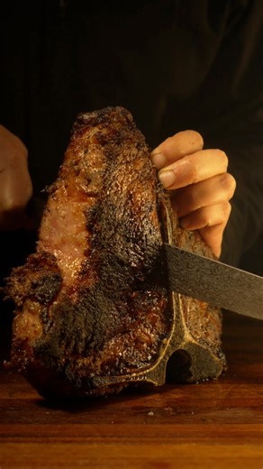 I love a good pastrami, and I wanted to see what would happen if I brined a cured a steak the same way. I started by making a classic pastrami brine with roasted spices, garlic, peppercorns, sugar, kosher salt, and curing salt. I heated it just enough for everything to fully dissolve, then dumped in ice to bring it back down to temperature. Once cooled, I submerged a massive three inch thick porterhouse steak and let it sit in the refrigerator for about seven days, moving it around every day or 