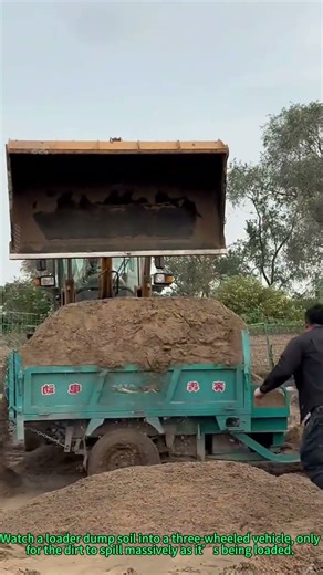 Loader Dirt Loading Mishap: Soil Spills During Trike Transportation