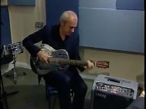 From the archives: During the opening of the Department of Music at Newcastle University in 2001, Mark took a moment to play the National Duolian steel guitar formerly owned by the blues legend, Booker T. White. The very same guitar was later referenced in the Eric Bibb song, 'Booker's Guitar'. | Mark Knopfler